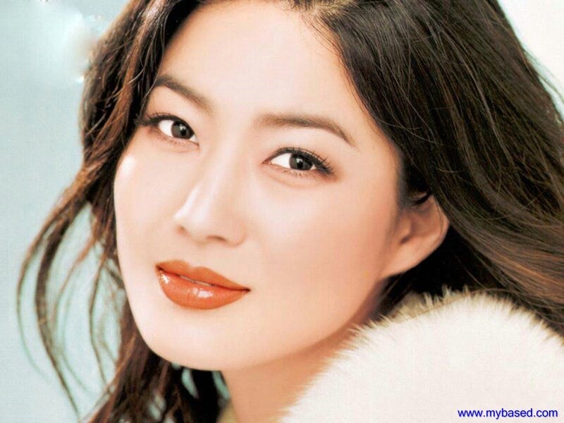 woman with brown hair and orange lipstick