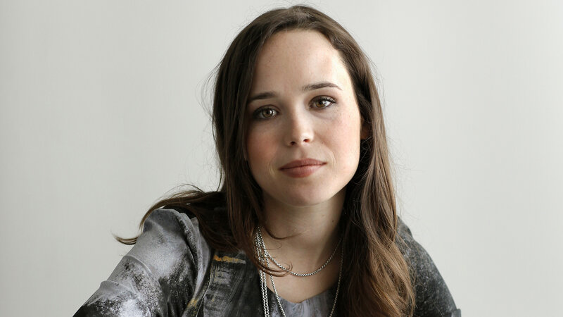 woman with brown hair and silver necklace