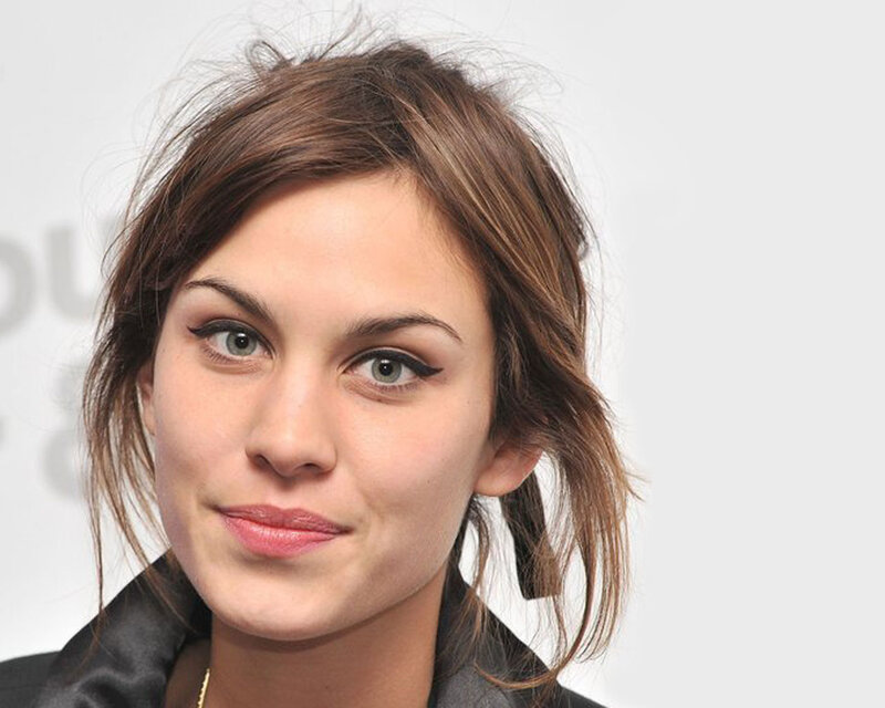 woman with brown hair and winged eyeliner