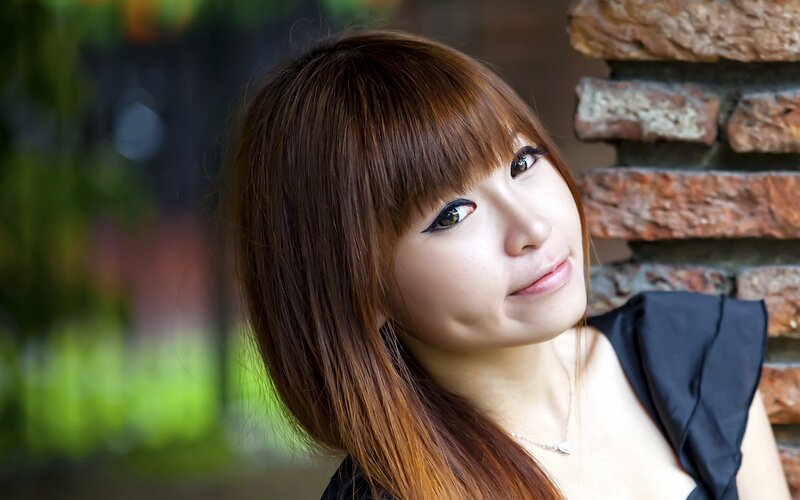 Woman with Brown Hair — Calm, Photograph, Brick Wall