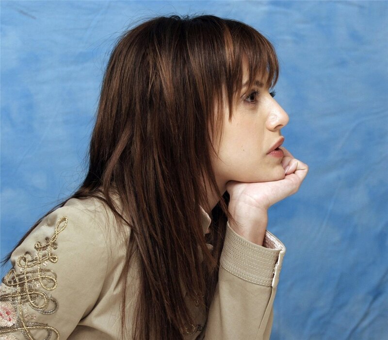 Woman with Brown Hair — Contemplative, Photograph, Hand, Jacket