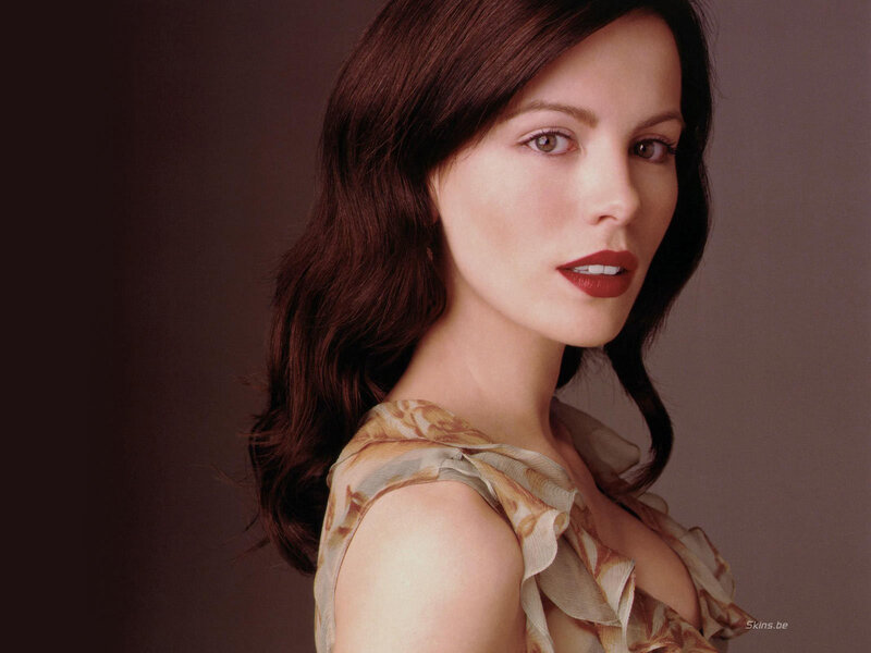 woman with brown hair in a floral top