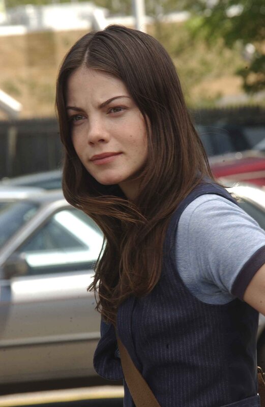 woman with brown hair in a parking lot