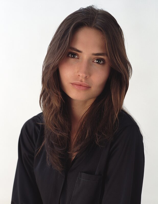 woman with brown hair in black shirt