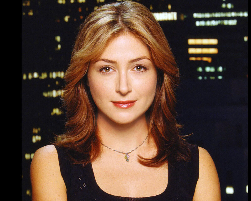 woman with brown hair in city