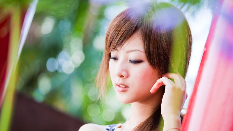 woman with brown hair in nature