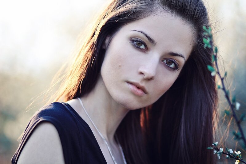 woman with brown hair in nature
