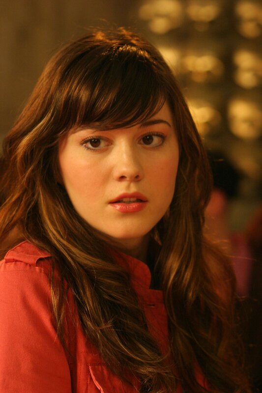 woman with brown hair in red shirt