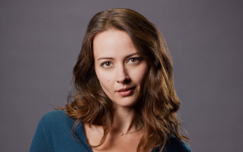woman with brown hair in studio