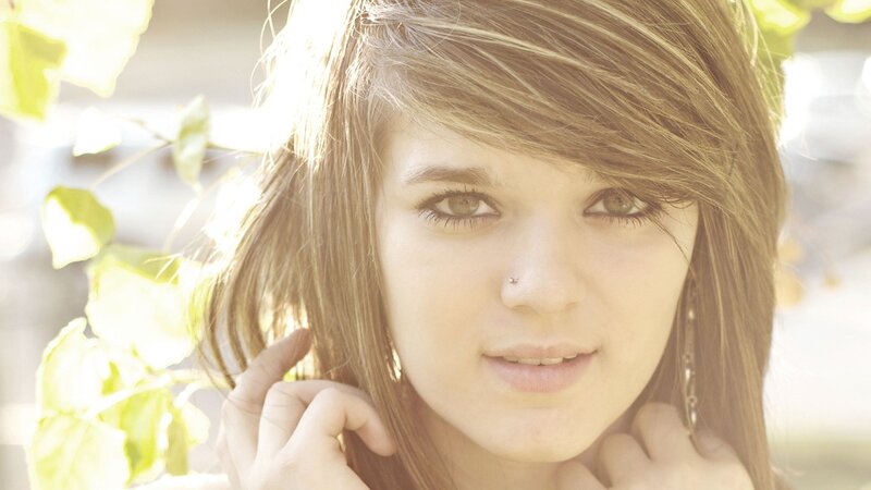 woman with brown hair in sunlight
