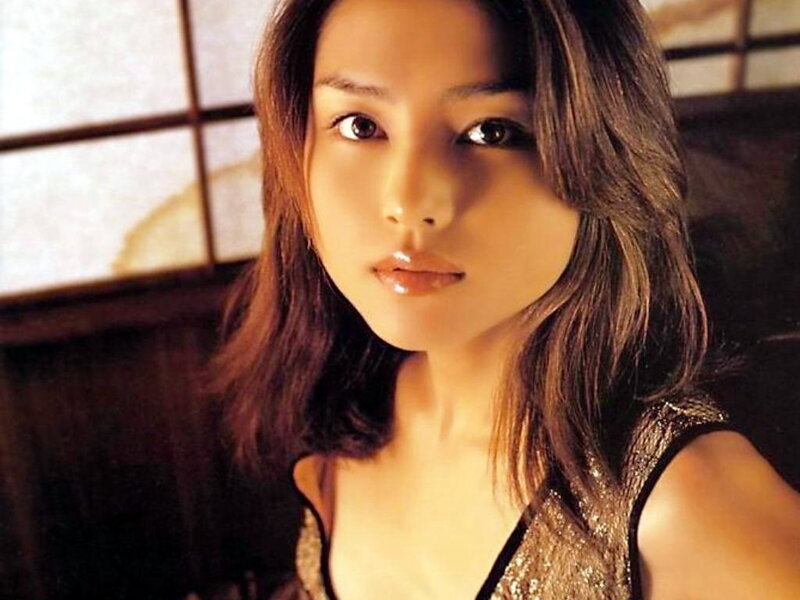 woman with brown hair in traditional room