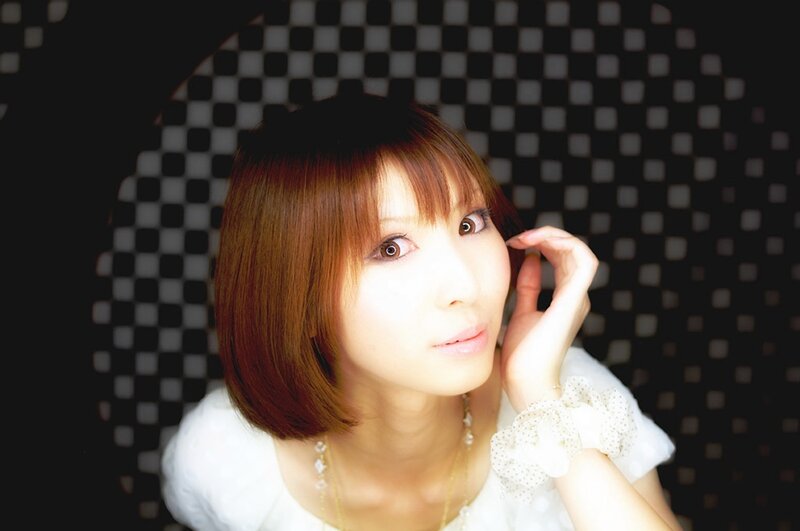 woman with brown hair in white dress