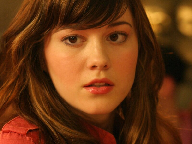 woman with brown hair looking