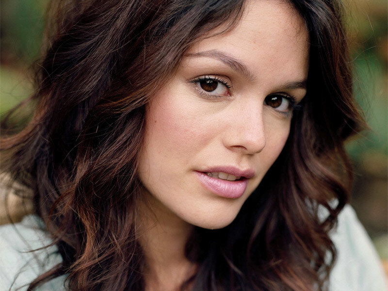woman with brown hair looking at camera