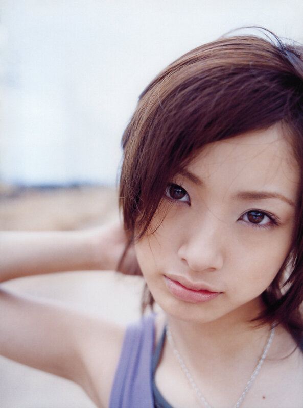 woman with brown hair looking at camera