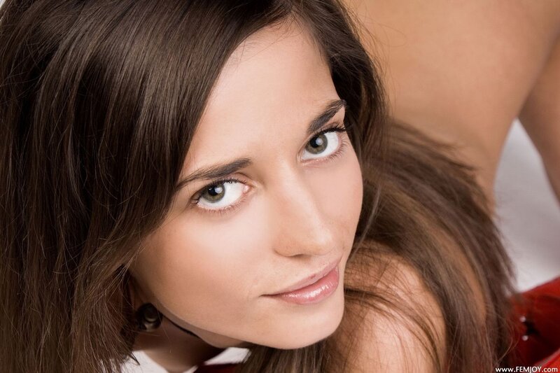 woman with brown hair looking at camera