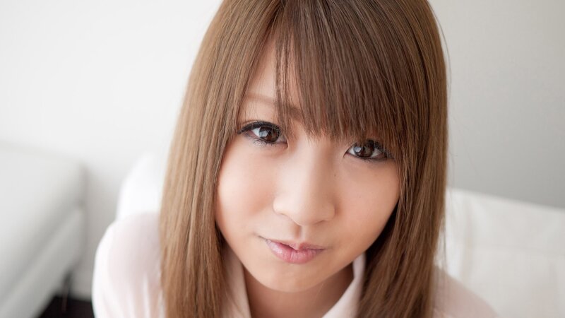 woman with brown hair looking at camera