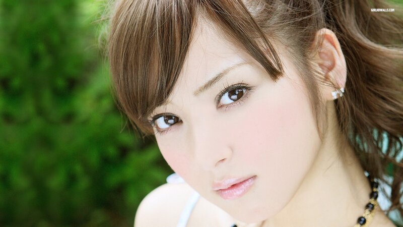 woman with brown hair looking at camera