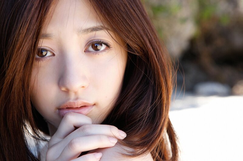 woman with brown hair looking at camera