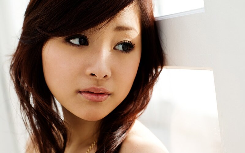 woman with brown hair looking away