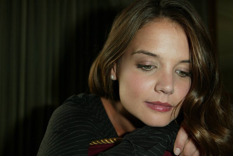 woman with brown hair looking down