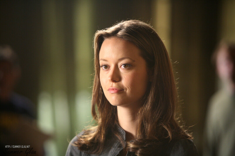 woman with brown hair looking off