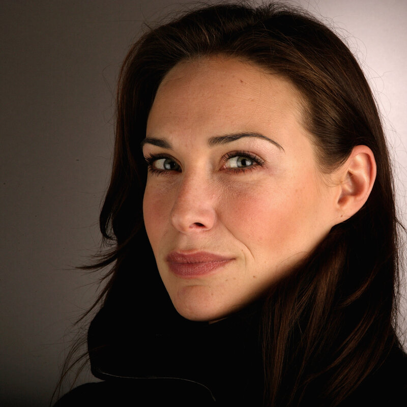 woman with brown hair looking up