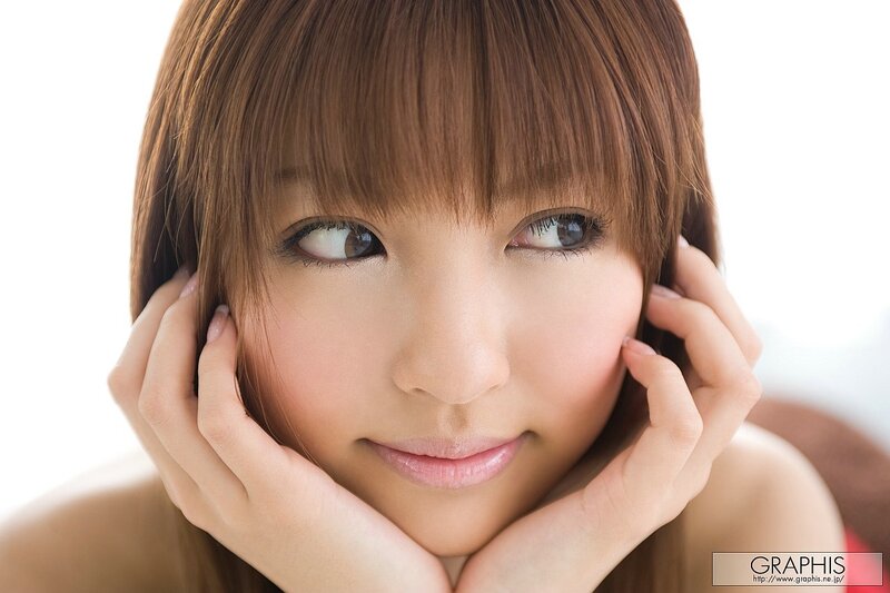 woman with brown hair looking up
