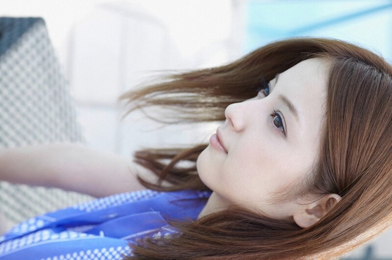 woman with brown hair lying down