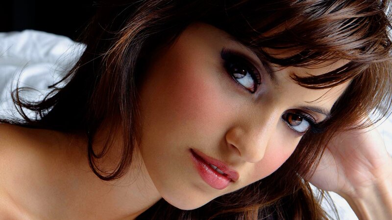 woman with brown hair lying down