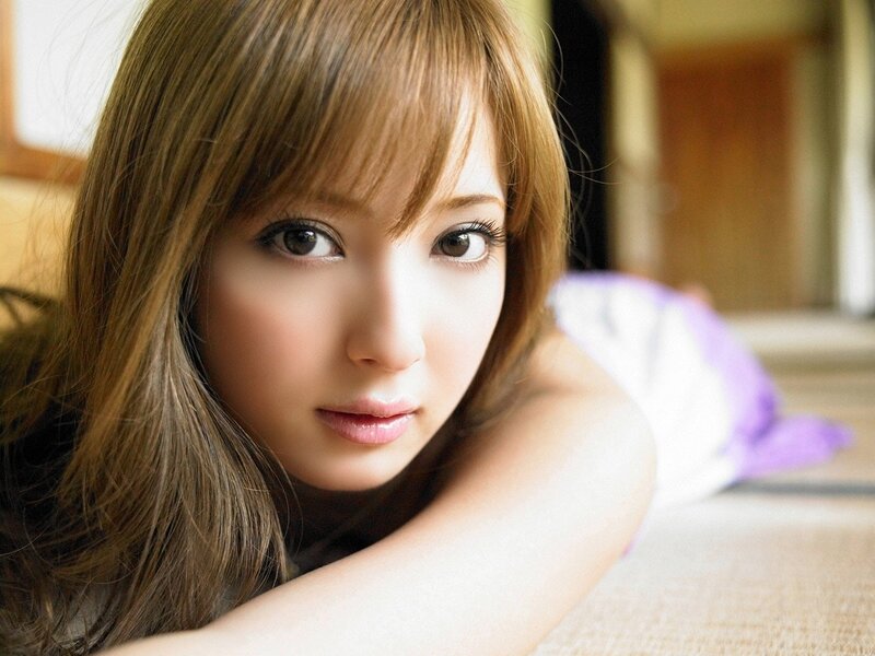 woman with brown hair lying down