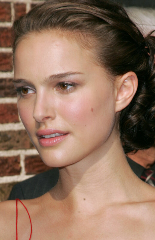 Woman with Brown Hair — Neutral, Photograph, Brick Wall, Red Strap