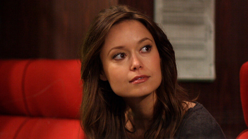 Woman with Brown Hair — Neutral, Photograph, Red Couch