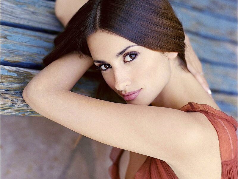 woman with brown hair on bench