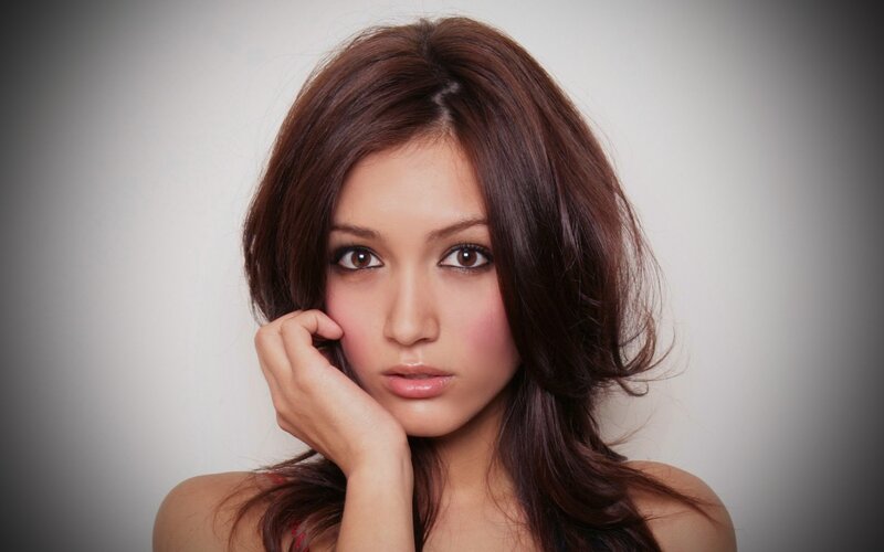 woman with brown hair posing