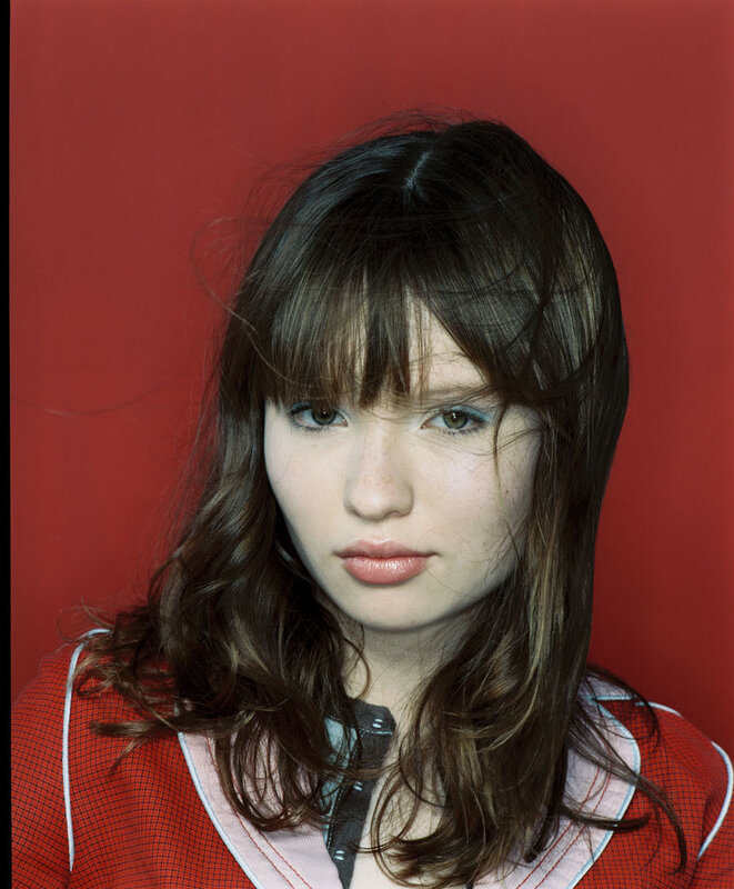 Woman with Brown Hair — Red, Neutral, Photograph, Red Background, Bangs