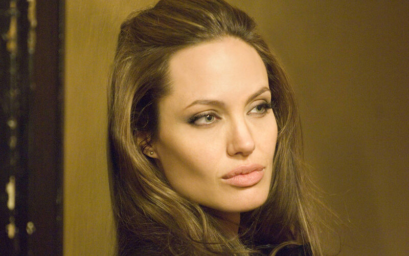 Woman with Brown Hair — Serious, Photograph, Earring