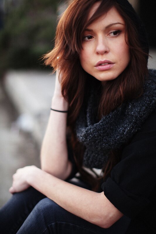 woman with brown hair sitting