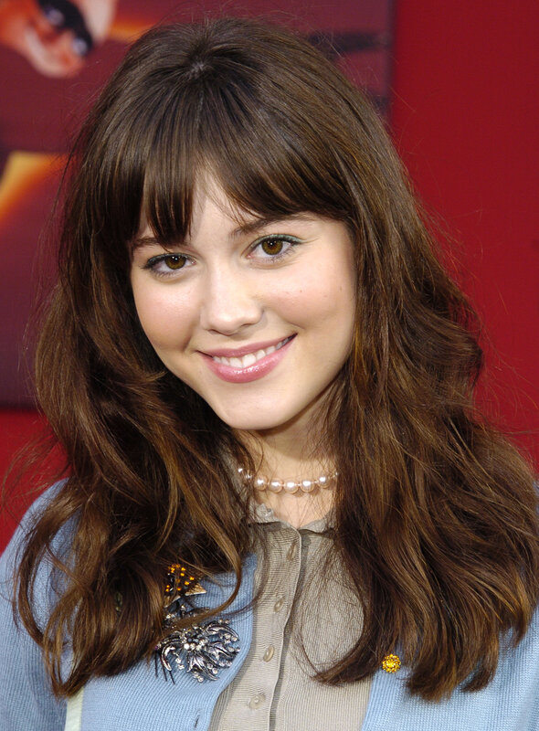 woman with brown hair smiling