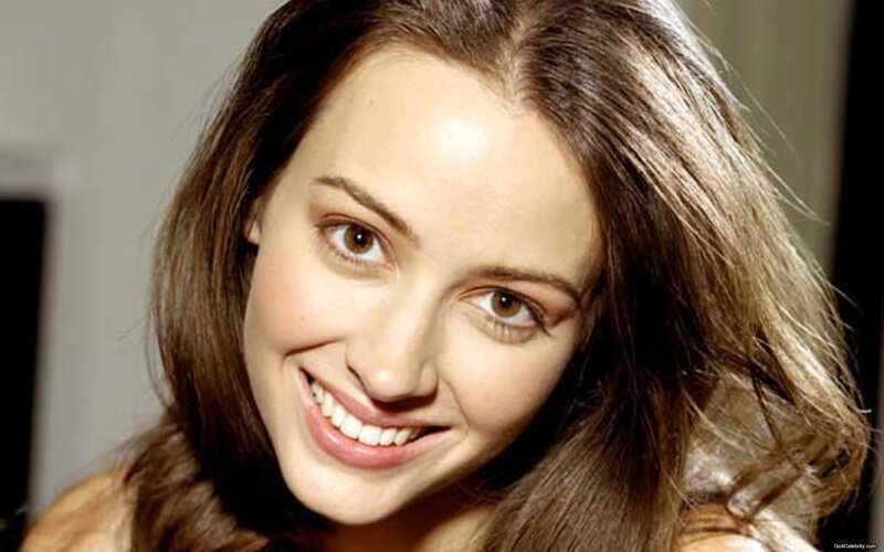 woman with brown hair smiling