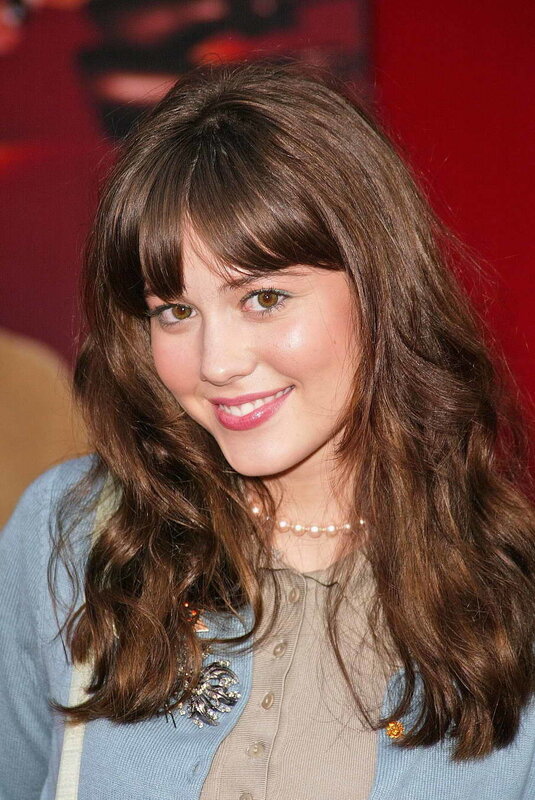 woman with brown hair smiling