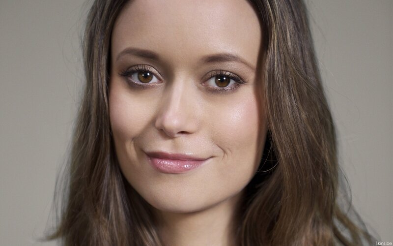 woman with brown hair smiling
