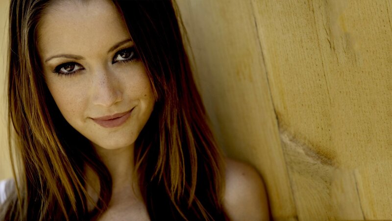 woman with brown hair smiling