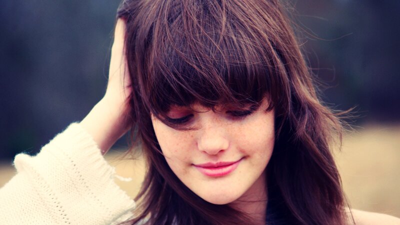 woman with brown hair smiling