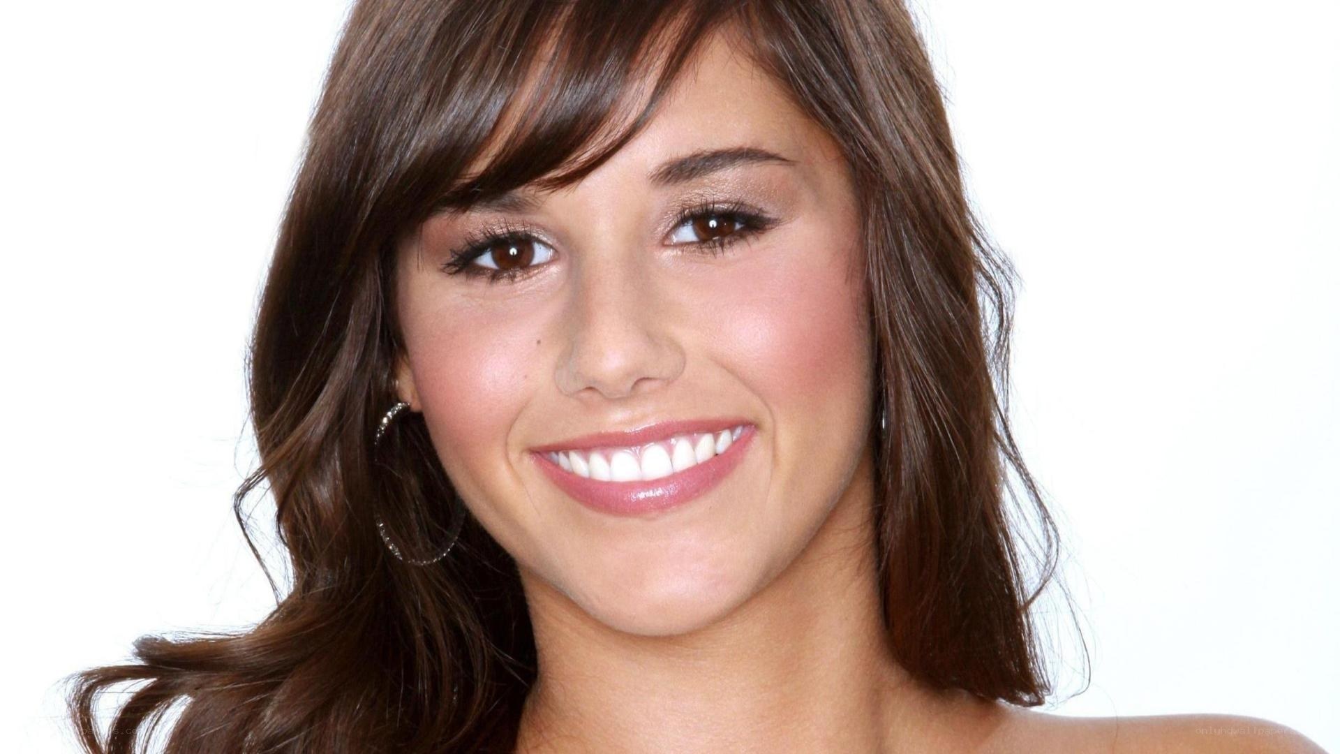 woman with brown hair smiling