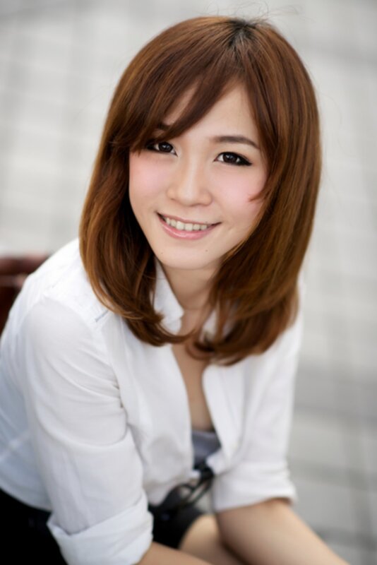 woman with brown hair smiling