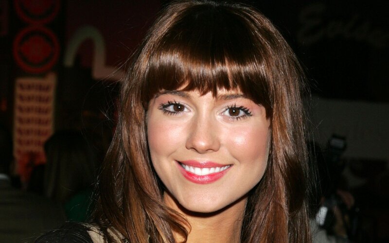 woman with brown hair smiling