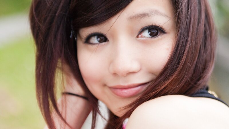woman with brown hair smiling