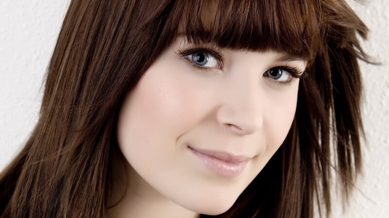 woman with brown hair smiling
