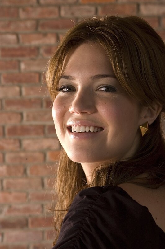 Woman with Brown Hair — Smiling, Photograph, Brick Wall, Gold Earring